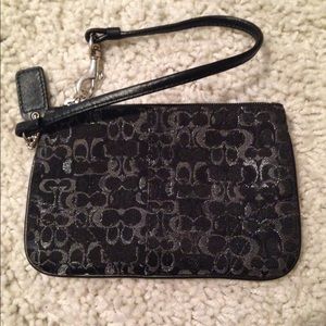 Black and silver coach wristlet